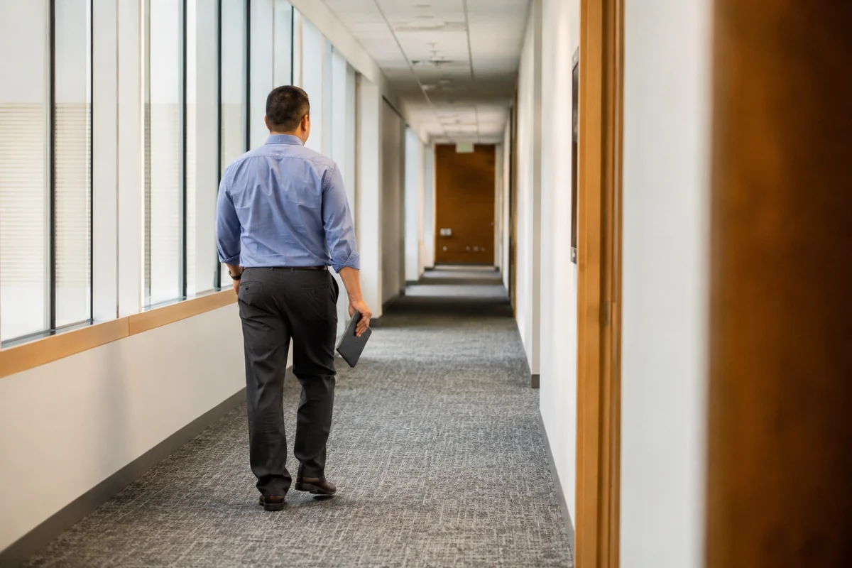 A facilities manager inspecting a corridor